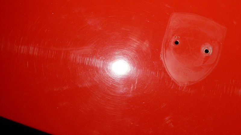 Holograms left by the body shop across a Porsche 993 C4S panel before polishing