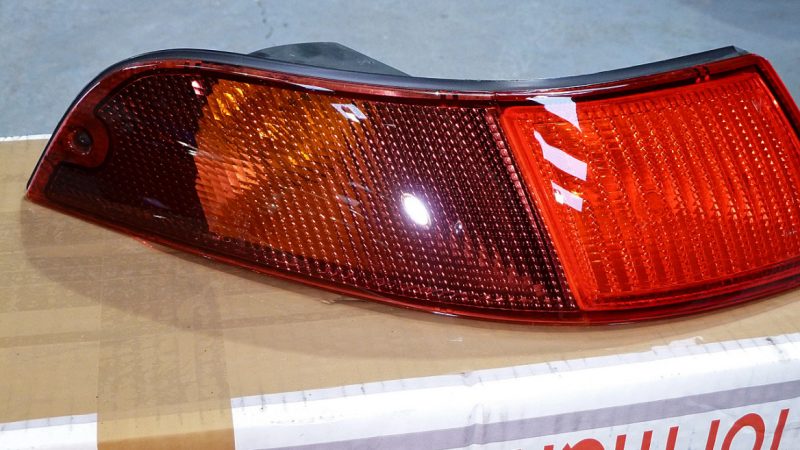 993 light cluster polished on the bench before being refitted to the car