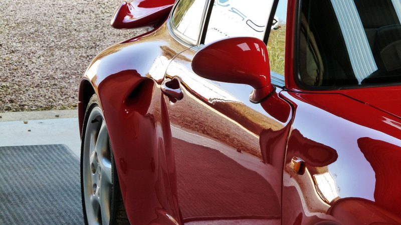 Front wing and mirror of the 993 C4S reflecting cleanly after correction
