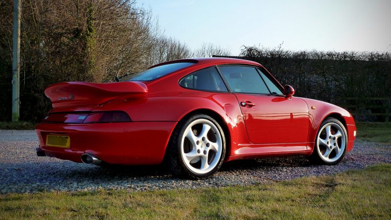 Rear three quarter of the 993 C4S showing the whale tail and wide arches