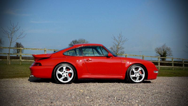 Finished Porsche 993 C4S in profile after three stages of machine polishing