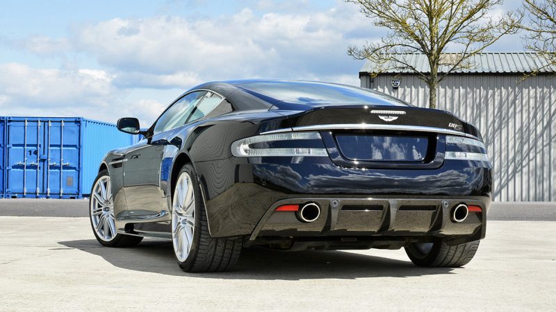 Rear three-quarter of the Aston Martin DBS showing the diffuser and exhausts