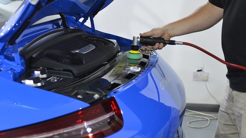 Polishing the GT3 RS engine lid with the rear deck raised