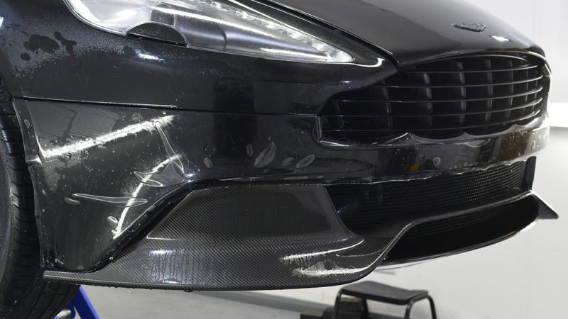 Front bumper and carbon splitter of the Vanquish after film installation
