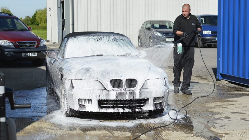 BMW Z3 covered in snow foam during the pre-wash outside our studio