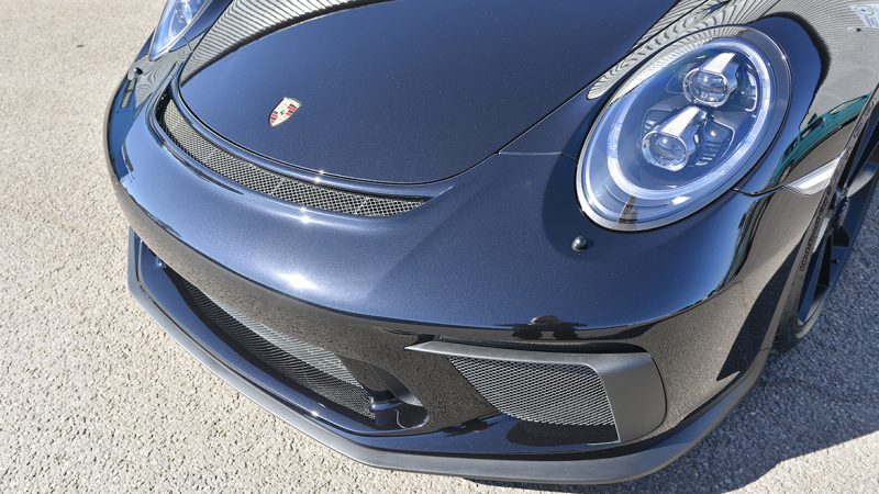 Front nose, headlight and splitter of the Jet Black Metallic Porsche 991.2 GT3 after PPF