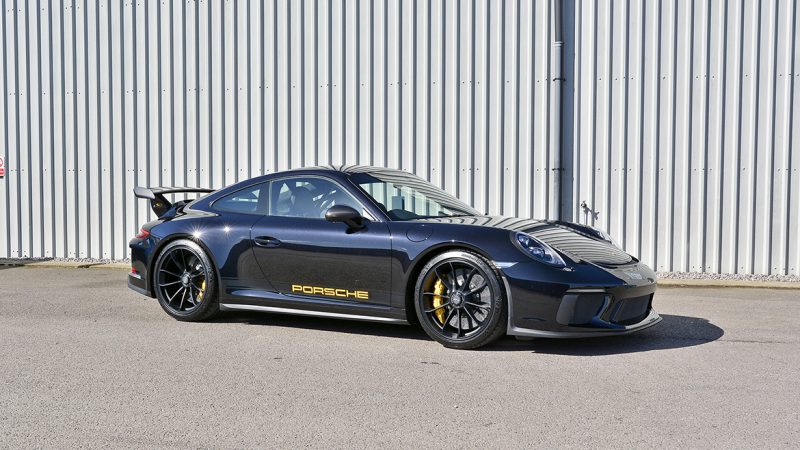 Porsche 991.2 GT3 side profile showing the yellow PORSCHE sill decals