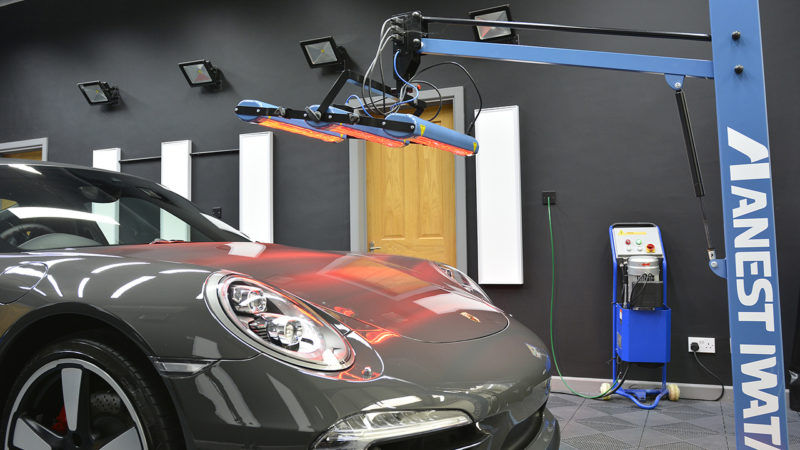 Porsche 911 50th Anniversary under the studio inspection lighting rig during paint correction