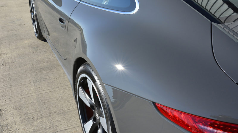 Door and rear quarter of the Porsche 911 50th Anniversary reflecting cleanly after correction