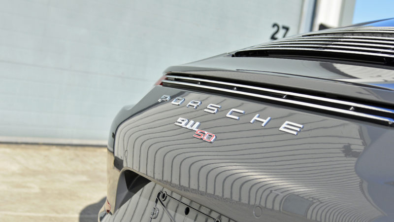 Chrome PORSCHE script and 911 50 badge on the engine lid of the 50th Anniversary Edition