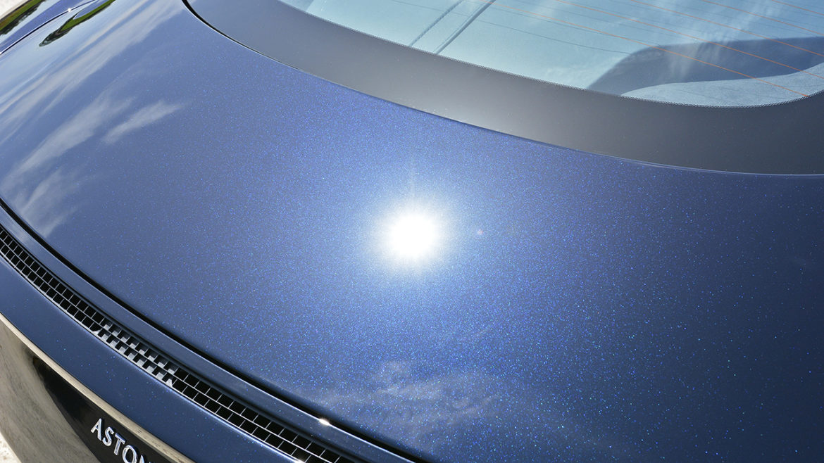 Clean reflection in the Aston Martin DB11 bonnet after machine polishing