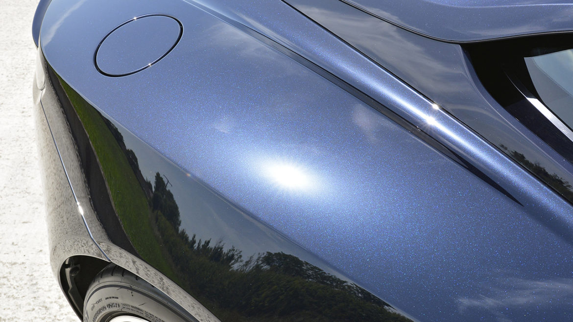 Rear quarter reflection on the Aston Martin DB11 after polishing