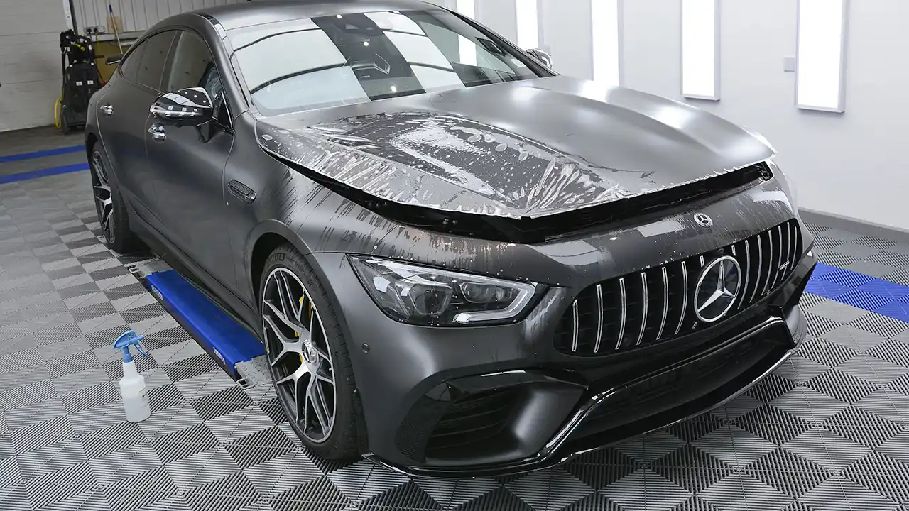 Satin PPF being installed on a Mercedes
