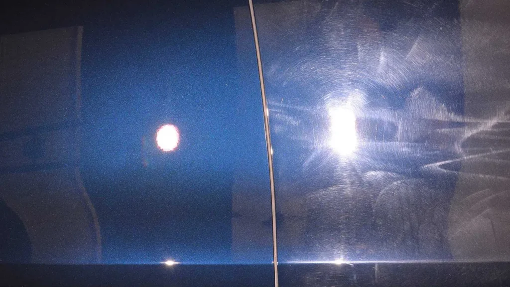 Swirl marks revealed under specialist lighting during a vehicle paint assessment.