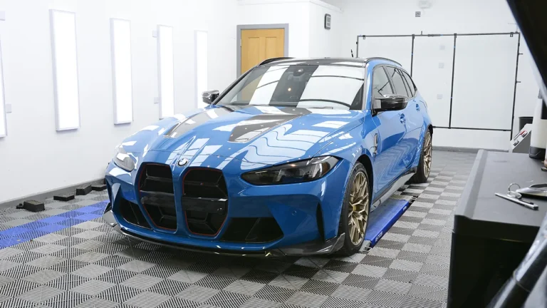 Front three-quarter of the Laguna Seca Blue M3 CS Touring after full PPF and ceramic coating