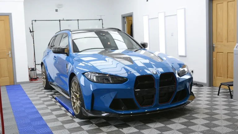 Side profile of the Laguna Seca Blue BMW M3 CS Touring protected with XPEL film