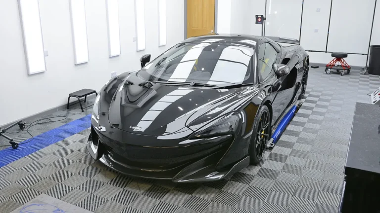 Front three-quarter of the fully filmed black McLaren 600LT